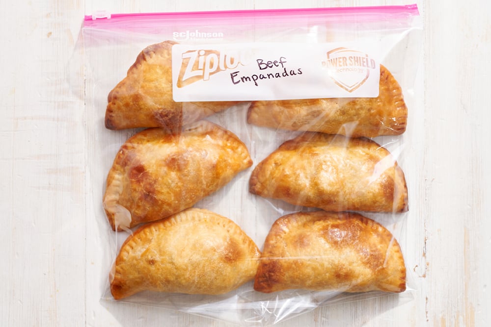 baked, cooled empanadas in a Ziploc bag, labeled and ready to freeze. 