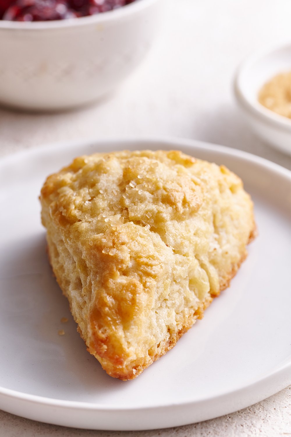 single scone on a white plate.