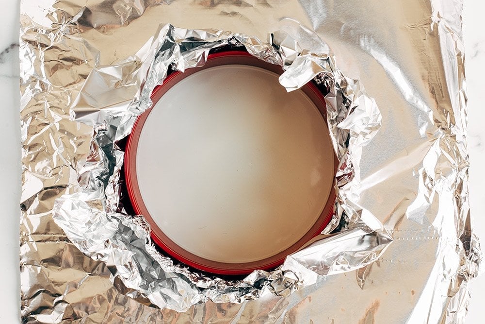 tinfoil wrapped around a springform pan for a cheesecake water bath.